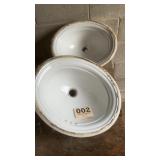 Two 16 inch oval sinks