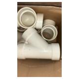 Assorted sizes of PVC couplers and pipe