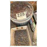 Bucket of nails and large staples