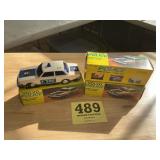 Lots of three Volvo police wind up toy cars with