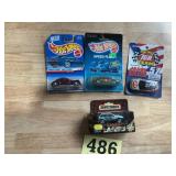 Lot of four diecast toy cars, all in original