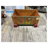 Vintage wooden toy box on wheels with animals
