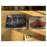 Lot of two plastic car model kits look to be in