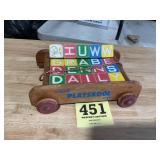 Vintage wooden blocks and play school toy wagon