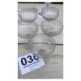 Five etched champagne flutes