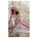 Vintage doll and doilies