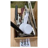 Box full of kitchen utensils