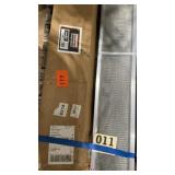 Two stacks of stainless steel gutter guard about