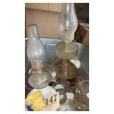Assorted glassware and two lanterns