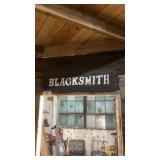 Wooden sign blacksmith