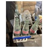 Antique soda crate with vintage bottles