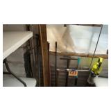 Wall lot coat rack, brooms, sweepers, a pic and