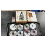 Small microscope in wooden box, CDs, DVDs, and