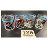 A set of four James Bond collectors drinking