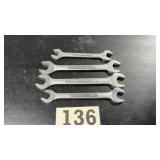 Four craftsman tools open, and wrenches