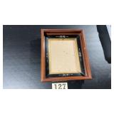Antique deep walnut frame looks to be for like an