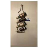 Wine rack with decorative grape juice bottles