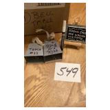 Box, full of bells, and little signs on easel