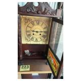 Vintage clock with pendulums and key top corner
