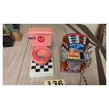 Two vintage still coin banks, both are made from