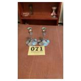 Silver colored metal candle sticks
