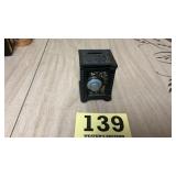 Vintage still  coin bank shaped like an old safe
