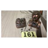 Two vintage brass like still banks, one of the
