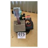 Central machine belt sander with extra belts