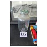 Approximately 1 gallon glass jar with glass lid