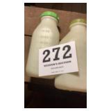 Two plastic measuring bottles