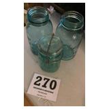 Three ball jars, one lidded