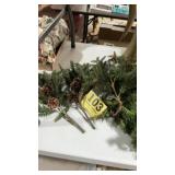 Lot of green swag, and door hanger with bells