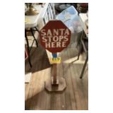 Wooden Santa comes to town stop sign