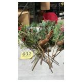 Lot of holiday berry, pine cones, greenery