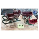 Two Christmas holiday slays, and wagon. The sleds