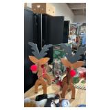 Set of handmade wooden reindeer, candy canes,