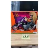 Musical, light up werewolf on motorcycle