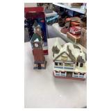 Porcelain clock tower and plastic house