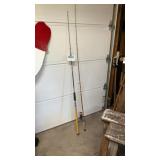Two fishing rods, one with real