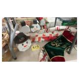5 stockings, homemade snowmen faces out of