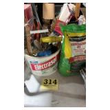 Bag of grass seed and gardening tools, brushes