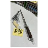 Knife sharpener and cap gun