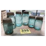 Six old blue ball mason jars with zinc lids