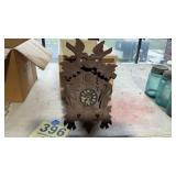 Old wooden wall hanging cuckoo clock with weights