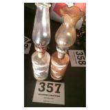 Two miniature oil lamps with eagle emblems on