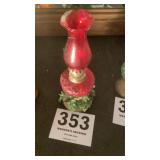 Miniature, red kerosene lamp
