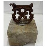 Antique cast iron boot scraper on granite block