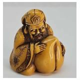 Netsuke- Antique carved ivory Buddha, signed
