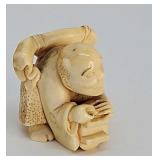 Netsuke- Antique carved ivory figure of a peasant