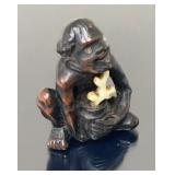 Carved box wood aboriginal figure with ivory inlay